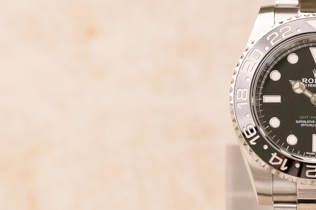 Rolex GMT-Master II ref. 116710LN — detail zwarte keramische lunette met 24-uursgraduatie