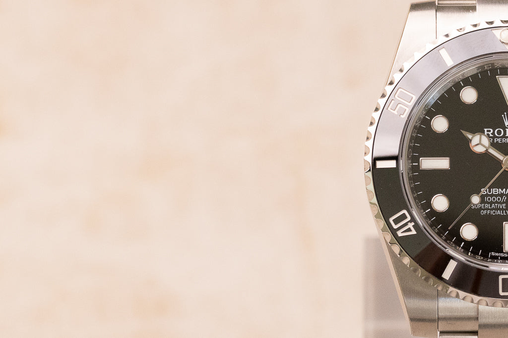Rolex Submariner Date ref. 116610LN — zwarte wijzerplaat met Cerachrom-lunette dial close up half